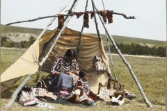 Blackfoot-woman-sweing-with-child-mearby-McClintock-800-677